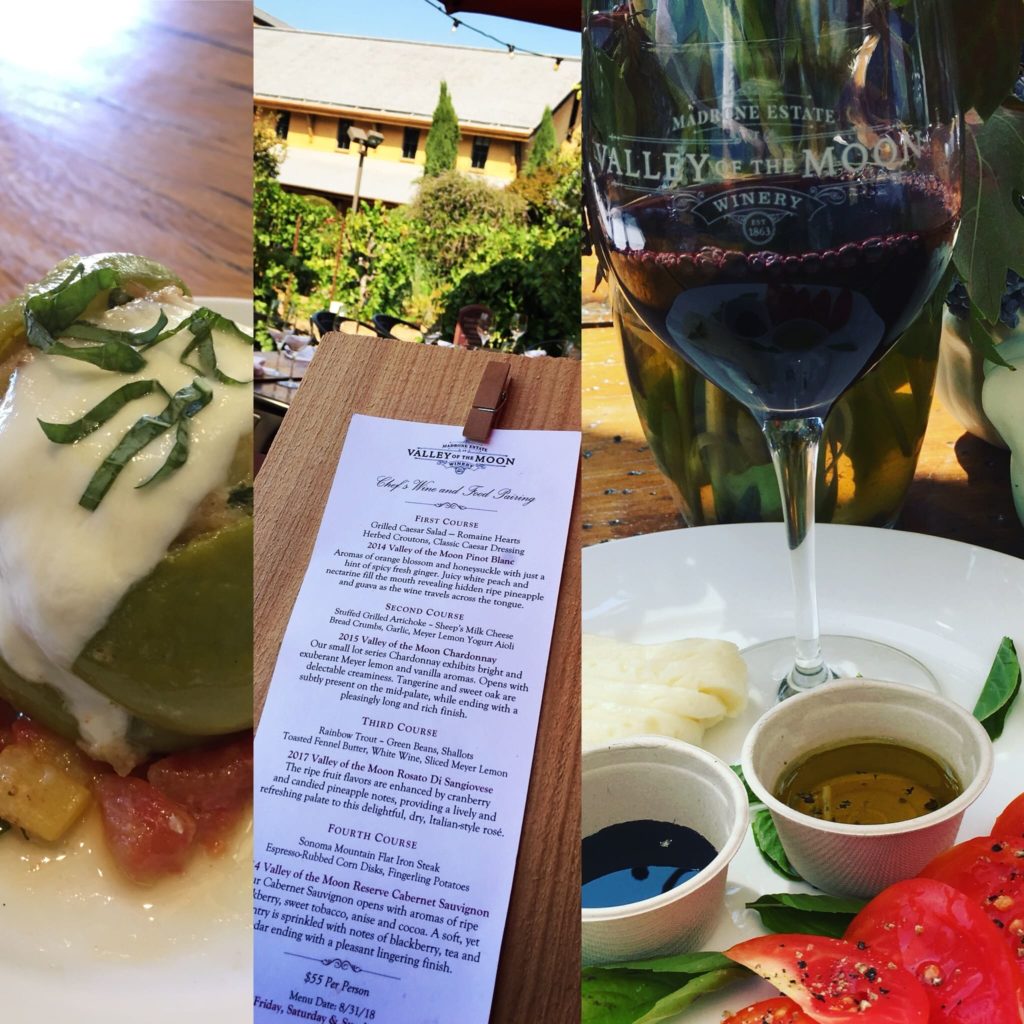A picture of an appetizer, a paper menu, and wine
