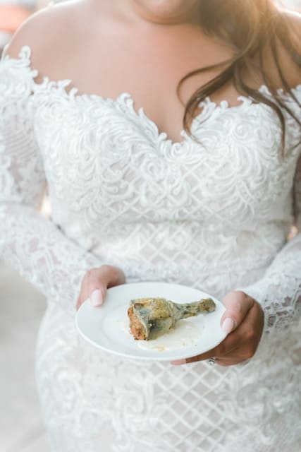 A bride holding a chicken dish